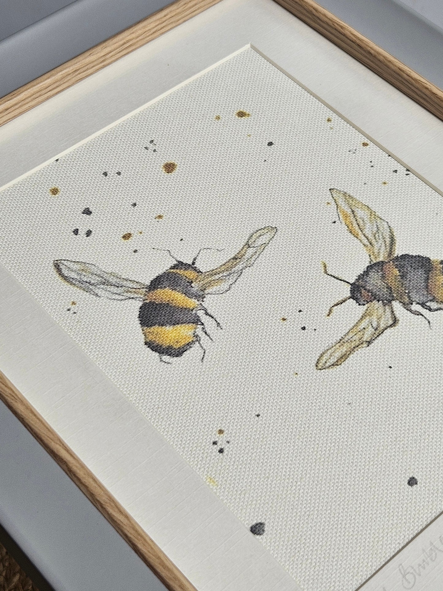 Double bee canvas print in grey wooden frame