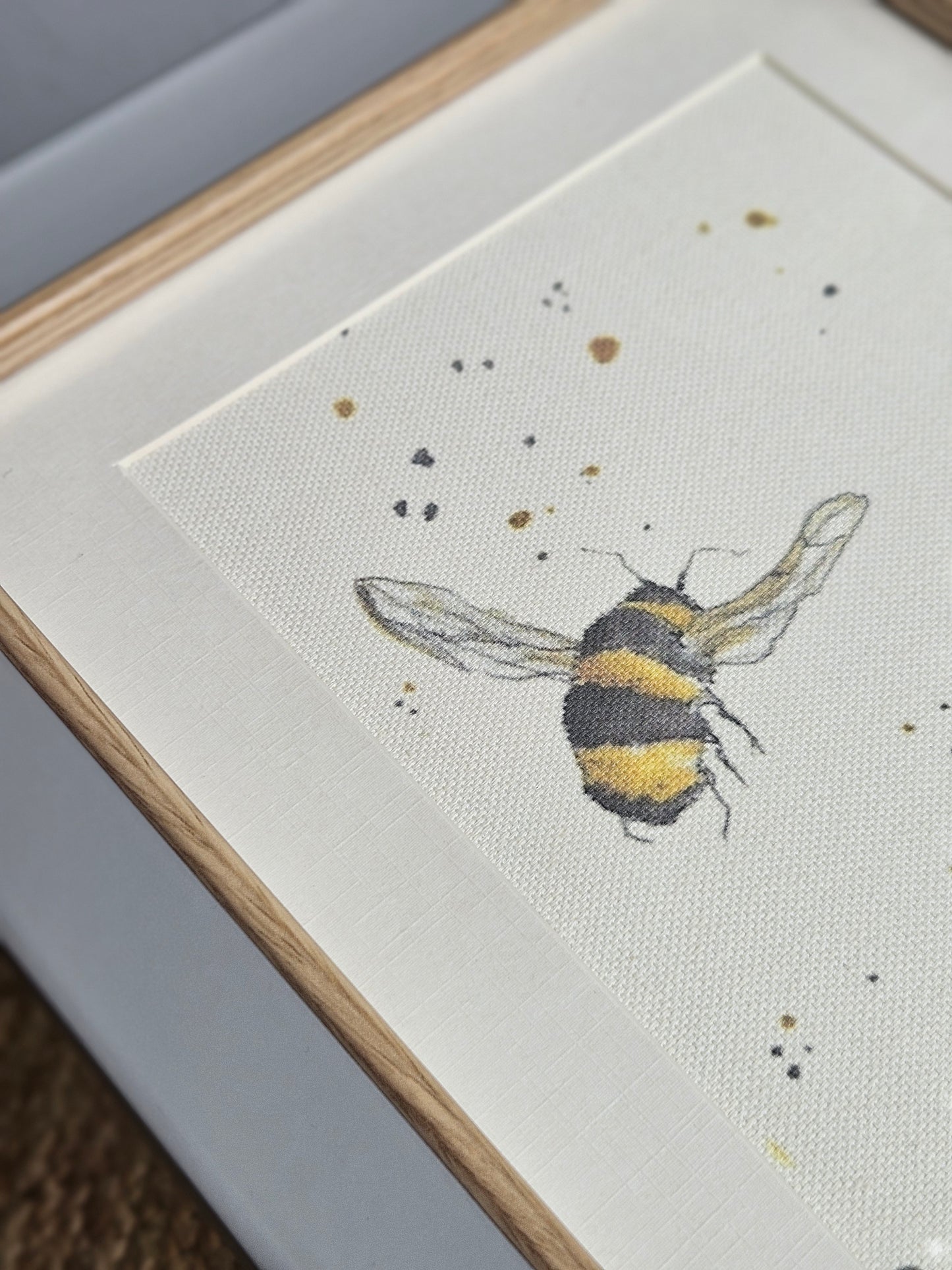 Double bee canvas print in grey wooden frame