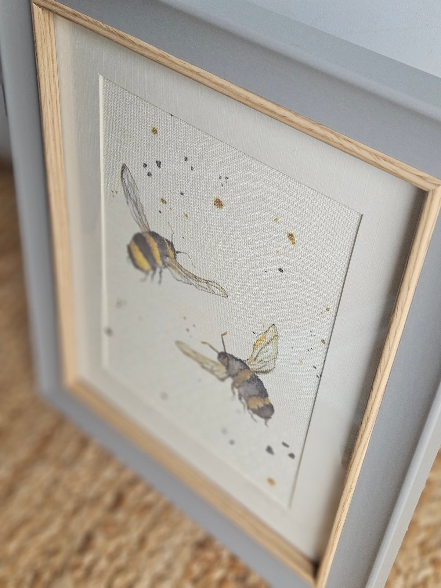 Double bee canvas print in grey wooden frame